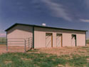 This 30x 40, 3-stall horse barn and workshop is the ideal Armor Steel Building for the multi-use client with a smaller budget.  The round vent on the top allows for greater airflow in the summer and the Dutch doors give the western look.