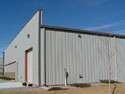 Commercial office and storage buildings with a unique look can ad aesthetics and resale value to your property.  This building features a parapet faade that covers the traditional gable end wall and features the semi-concealed wall panel that enhances the outer appearance.
